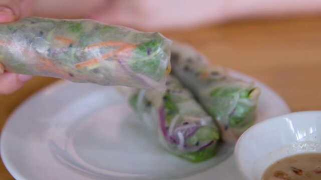 fresh spring rolls to dip in sauce Cooking Fresh Vietnamese Spring Shrimp Rolls. Healthy food.