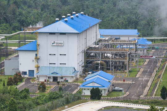 Aerial view of the Pertamina Geothermal Energy plant at Ulubelu, featuring blue-roofed industrial buildings surrounded by lush tropical forest. Lampung, Indonesia 11 Februari 2026.
