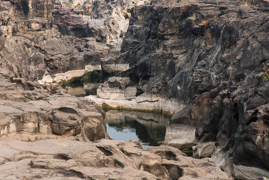 Natural rock cut formations, Potholes, ranjankhalage, the riverbed of the Kukadi River, Nighoj near Pune, Maharashtra, India. 