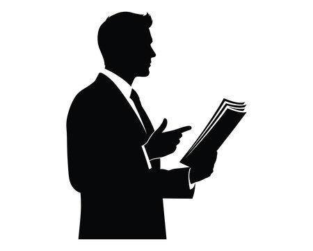 Silhouette of a man in a suit reading a book