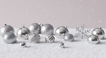 Shiny silver christmas ornaments on snowy surface with snowflake decoration