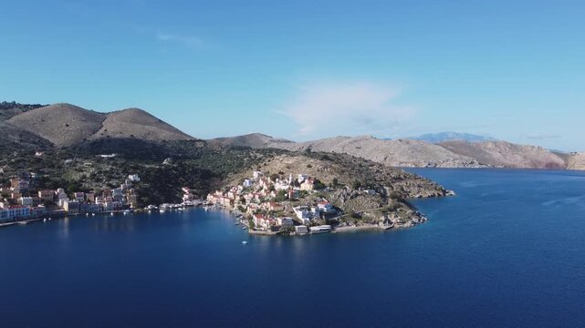 Bay and Town of Symi With Blue Water, Greece