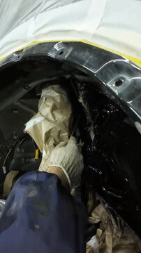 Glossy Underbody Final Coat Applied Across Floor Pan And Frame Rails. HighShine Protective Layer Reflects Shop Lights, Even Coverage Over Ribs And Cavities, Masking Removed In Areas Showing Cured