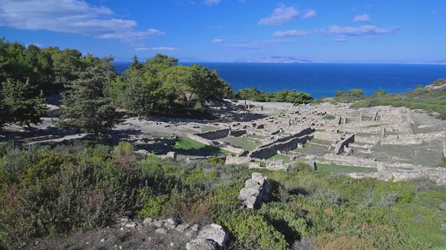 Stone ruins of Kamiros with sea view on Rhodes island in Greece