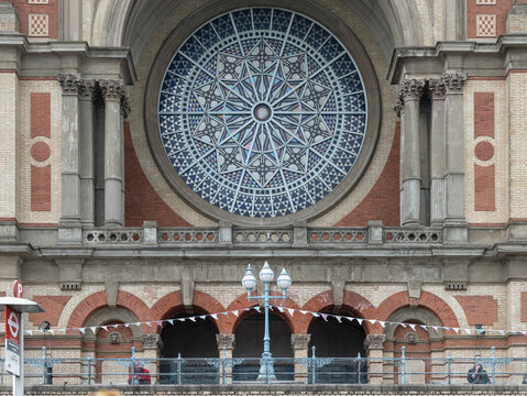 The South facade with the Rose window of Alexandra Palace built was originally named "The Palace of the People" or Ally Pally is a Grade II-listed venue with central frontispiece featuring yellow.