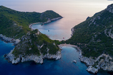 Fototapeta premium Aerial view of the famous twin beaches of Porto Timoni in Corfu, Greece, a hidden gem with crystal clear turquoise water, rocky coves,