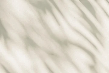 Fototapete Badezimmer Abstract  light shadow of leaf blurred background. Natural diagonal leaves tree branch shadows and sunlight on white wall. Shadow overlay effect foliage mockup  © merrymuuu