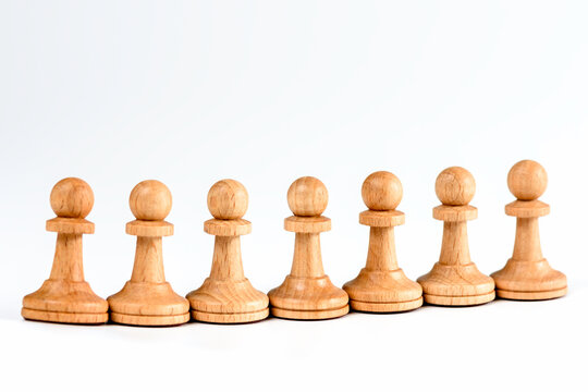 Chess pieces are pawns on white background. Business concept and decision strategies.