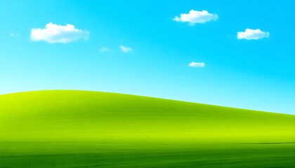 Obraz premium Serene landscape of a green hill under a blue sky with white clouds from a distant viewpoint