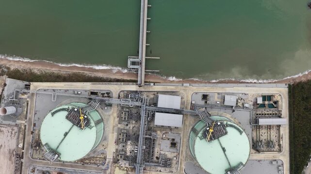 Aerial top down view of a coastal lng terminal