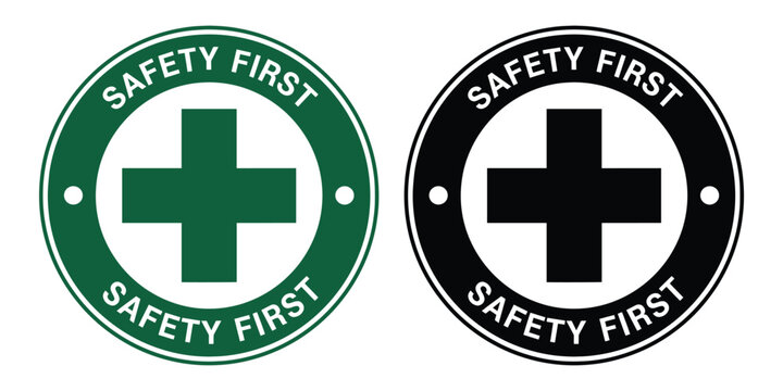Two safety first signs with green and black color schemes and cross symbols