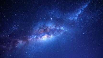 Fototapeta premium Cosmic Tapestry: A mesmerizing view of the night sky, showcasing a vibrant array of stars and nebulas, offering a glimpse into the vastness of the universe.