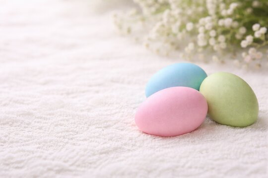 easter eggs on the white fluffy carpet. easter celebration background closeup view
