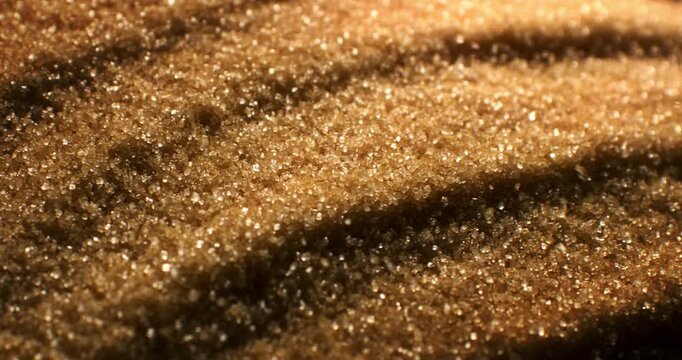 Brown Sugar Crystal Macro Close Up. Sparkling Granulated Texture Concept Of Sweet Food Background