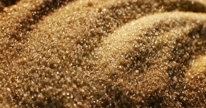 Brown Sugar Crystal Macro Close Up. Sparkling Granulated Texture Concept Of Sweet Food Background