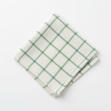Folded square kitchen towel or napkin with a green gingham checkered pattern, isolated on a white background.