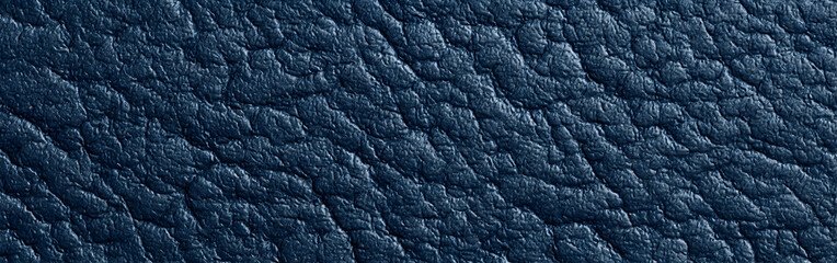 Dark blue leather texture surface for furniture advertisement. Close up of abstract material for product backdrop.