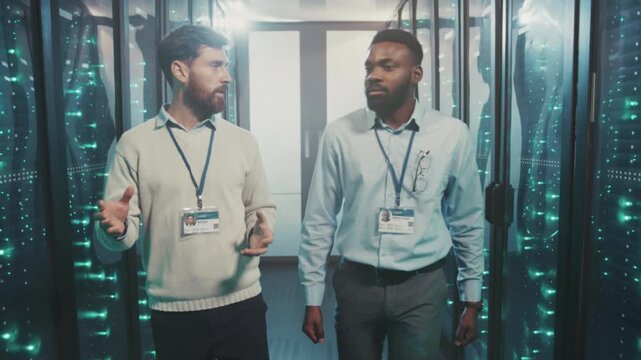 Mentor assists junior through system setup, Instructor guides trainee through server configuration with calm precision