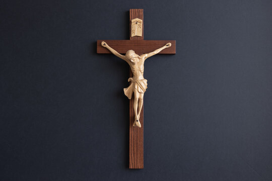 Isolated crucifix on a black background with copy space