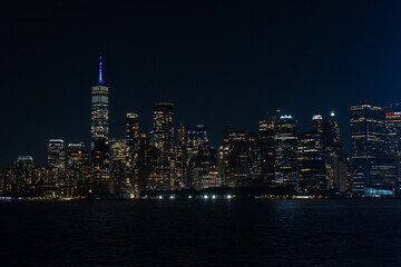 New York City Skyline at Night with Illuminated Skyscrapers and City Lights