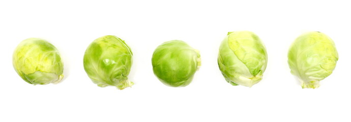 Obraz premium Set fresh raw brussels sprouts isolated on white background, top view