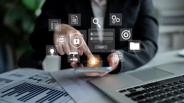 A business professional uses a smartphone to interact with digital data in a modern office, embodying the seamless integration of technology and communication. Gantry