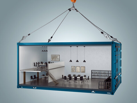Industrial shipping container converted into a modern two-story office space with meeting rooms and workspace, suspended by crane hooks.