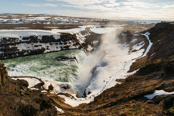 Fototapeta premium Panoramic view Gullfoss waterfall, showing the waters of river Hvítá plunging down its lower stage into a crevice, Golden Circle Route, Iceland