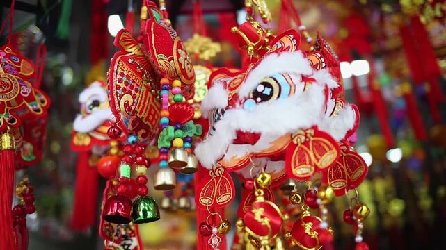 Colorful red and golden decorative elements sold on an vietnamese street market prior to the Tet holiday or Lunar new year in Vietnam, Asia. Selective focus close up video.