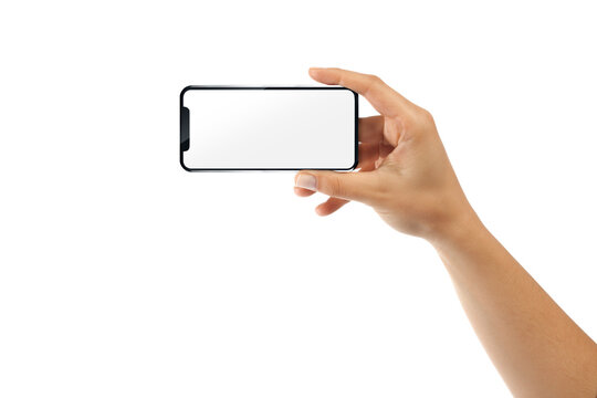 Hand holding a modern smartphone in horizontal landscape position isolated on white background. Blank white screen mockup for mobile application interface, mobile gaming, responsive website design 