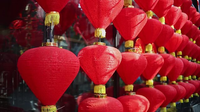 Colorful red and golden decorative elements sold on an vietnamese street market prior to the Tet holiday or Lunar new year in Vietnam, Asia. Selective focus close up video.