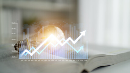 A creative image showcasing a light bulb over a book with a growth graph, symbolizing innovation,...