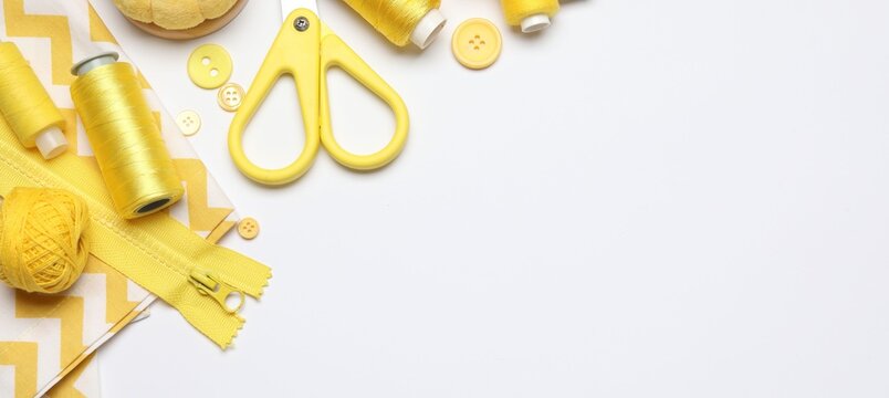 Different sewing supplies on white background, flat lay. Space for text