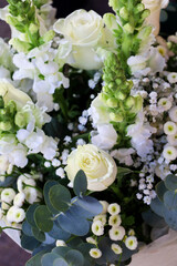 White roses and Antirrhinum majus bouquet