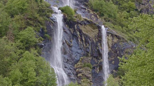 Twin waterfalls that plunge into the valley, Acquafraggia waterfall, Borgonuovo, Lombardy, Italy.