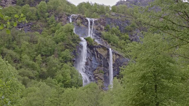 Twin waterfalls that plunge into the valley, Acquafraggia waterfall, Borgonuovo, Lombardy, Italy.