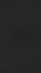 black background with small white specks