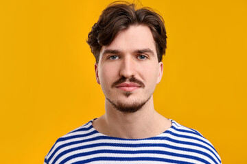 Obraz premium Handsome man with mustache on orange background