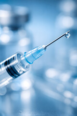 Macro close-up of a vaccination syringe with liquid droplet on needle, symbolizing HPV immunization and medical precision in a sterile blue clinical environment.
