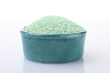 Green sea salt in bowl isolated on white