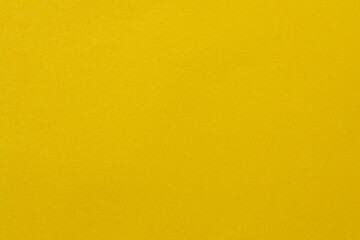 Obraz premium Bright Yellow Solid Color Background with Smooth Surface for Design Projects Template