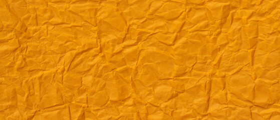 Orange Crumpled Paper Texture Background with Wrinkled Surface Pattern