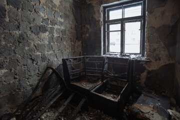 Aftermath of fire. Burnt domestic room interior