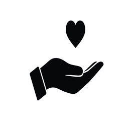Fototapeta premium A hand with a heart above it symbolizing love and care