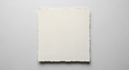 Blank square vintage paper sheet with rough torn edges placed on smooth gray surface flat lay minimalist creative background with natural texture and soft neutral colors