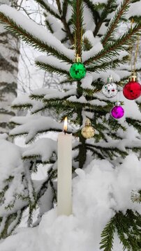 New Year's toys and a candle on the tree