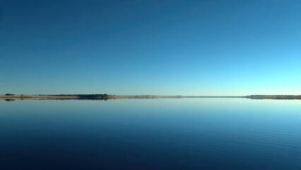 Obraz premium Calm Water Landscape Under Blue Sky