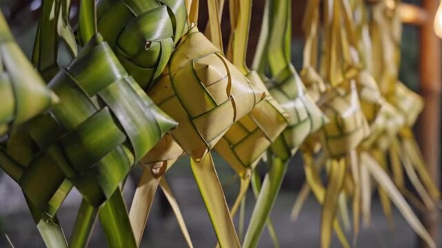 A row of hanging Ketupat a traditional Southeast Asian food.