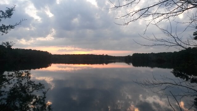 A beautiful colorful sunset over Lake Fred at Stockton University.