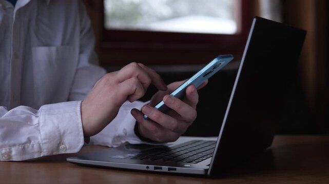 Person Interacts With Various Electronic Gadgets For Work And Finance. Individual Utilizes Smartphones And Laptops To Perform Financial Activities And Communicate Online With Ease